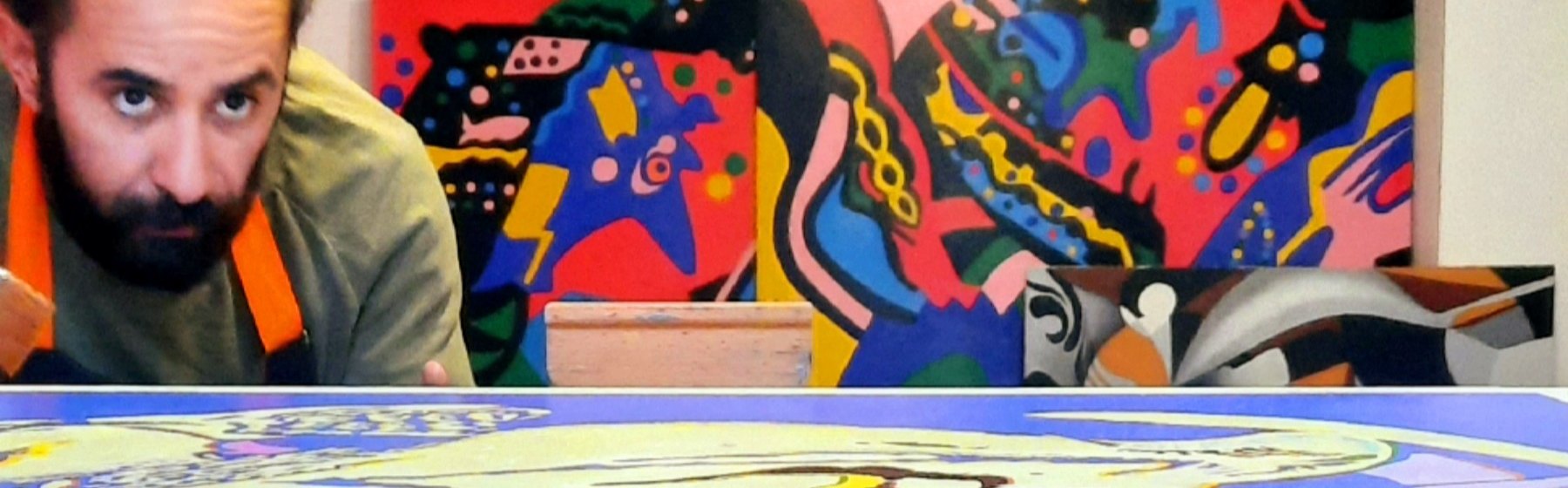 Claudio Rojas in his studio, among his paintings